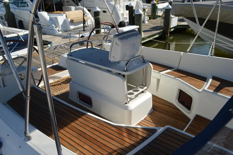 Slide: The Image of 2008 Jeanneau Sun Odyssey 45 DS yacht cockpit with wooden deck and steering wheel. - 32