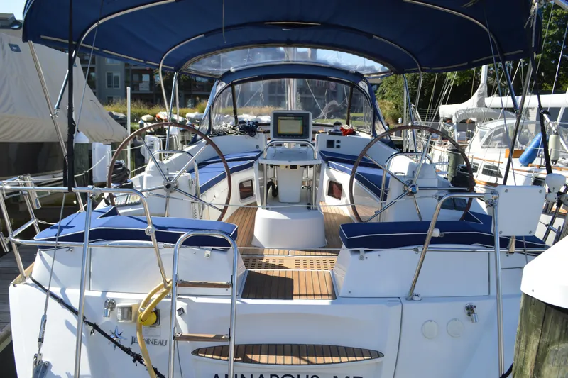 Slide: The Image of 2008 Jeanneau Sun Odyssey 45 DS sailboat with dual steering wheels and blue canopy. - 35