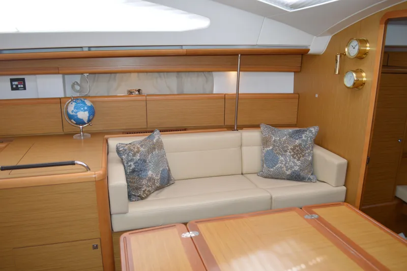 Slide: The Image of Interior of 2008 Jeanneau Sun Odyssey 45 DS yacht with beige sofa and decorative pillows. - 46