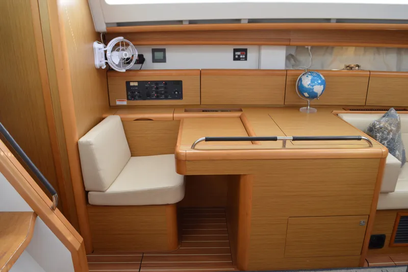 Slide: The Image of Interior of 2008 Jeanneau Sun Odyssey 45 DS yacht with wooden finish and seating area. - 48