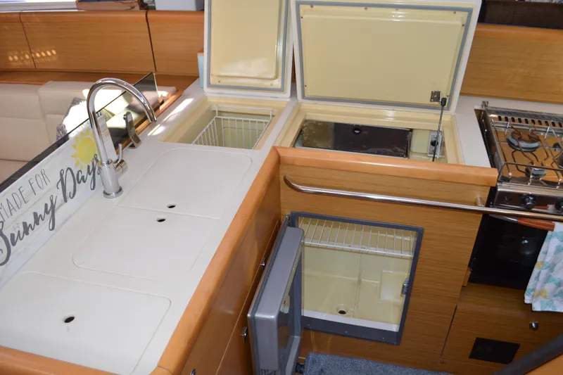 Slide: The Image of 2008 Jeanneau Sun Odyssey 45 DS yacht kitchen with sink, stove, and storage. - 52