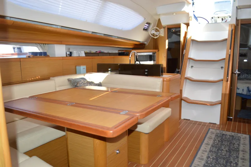 Slide: The Image of Luxurious interior of 2008 Jeanneau Sun Odyssey 45 DS sailboat with wooden furnishings. - 58