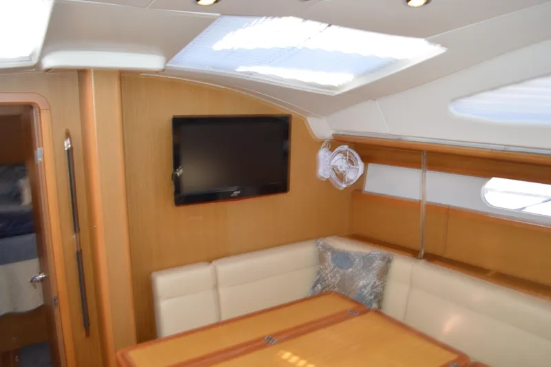 Slide: The Image of Interior of 2008 Jeanneau Sun Odyssey 45 DS yacht with seating, table, and TV. - 61