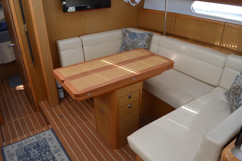 Slide: The Image of Interior of 2008 Jeanneau Sun Odyssey 45 DS yacht with elegant seating and wooden table. - 62