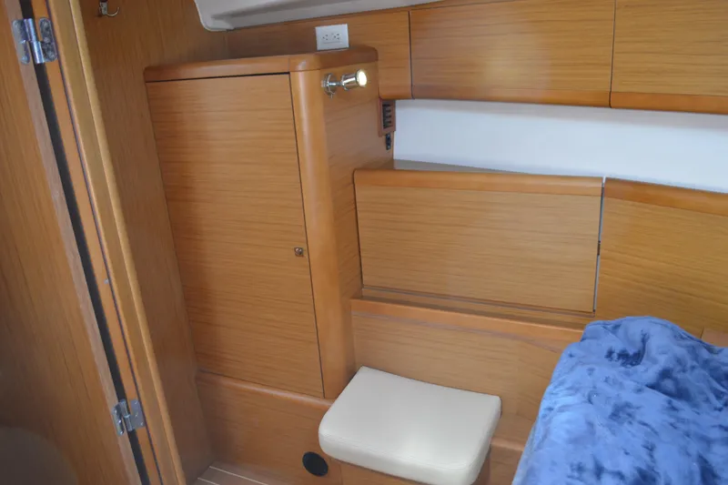 Slide: The Image of Interior of 2008 Jeanneau Sun Odyssey 45 DS, featuring wooden cabinetry and seating. - 66