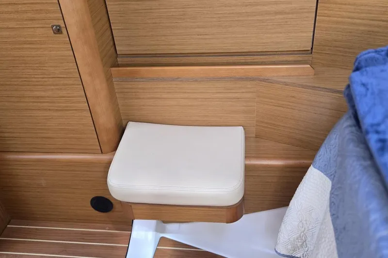 Slide: The Image of Interior of 2008 Jeanneau Sun Odyssey 45 DS yacht with wooden paneling and cushioned seat. - 68