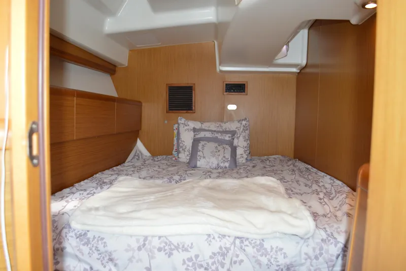 Slide: The Image of Cozy cabin interior of 2008 Jeanneau Sun Odyssey 45 DS sailboat with floral bedding. - 78