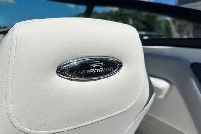 Slide: The Image of 2026 Chaparral 21 SSi boat interior with logo on white upholstery. - 14