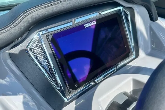 Slide: The Image of Simrad display on 2026 Chaparral 21 SSi boat dashboard, featuring sleek design and modern technology. - 18