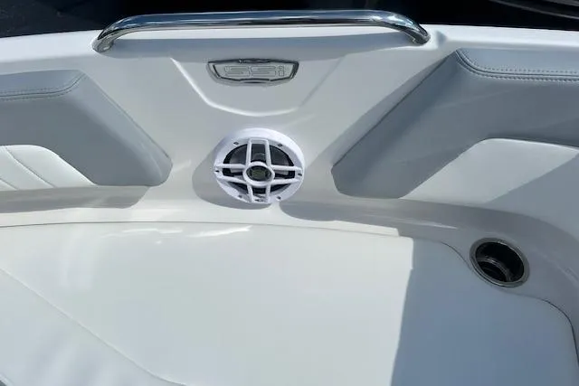 Slide: The Image of 2026 Chaparral 21 SSi boat interior with speaker and stainless steel handle. - 23