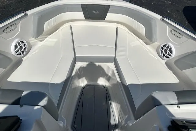 Slide: The Image of 2026 Chaparral 21 SSi boat interior with white seating and speaker system. - 24