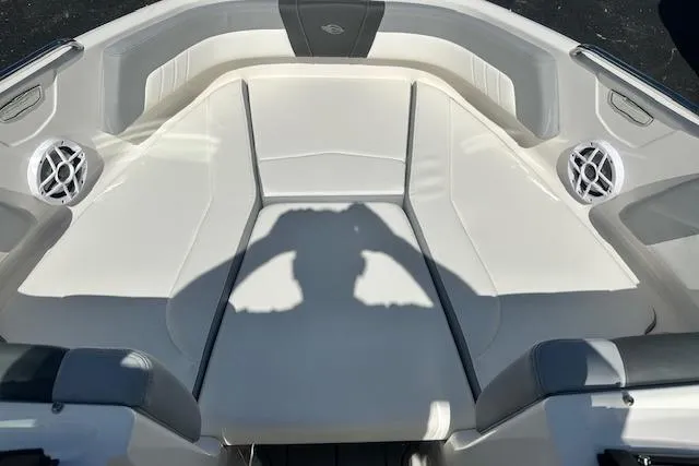 Slide: The Image of 2026 Chaparral 21 SSi boat interior with white seating and speaker system. - 25