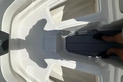 Slide: The Image of 2026 Chaparral 21 SSi boat interior with shadow and footrest detail. - 26