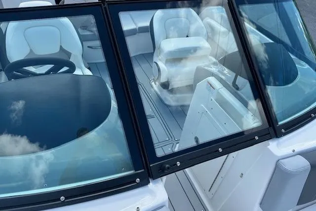 Slide: The Image of 2026 Chaparral 21 SSi boat interior with sleek seating and modern design. - 27