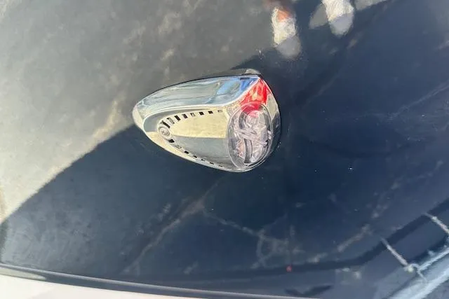 Slide: The Image of Close-up of a 2026 Chaparral 21 SSi boat light on a dark surface. - 4