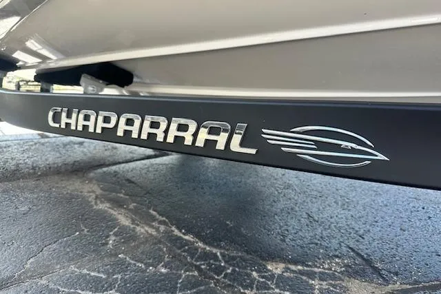 Slide: The Image of 2026 Chaparral 21 SSi boat trailer detail on pavement. - 5