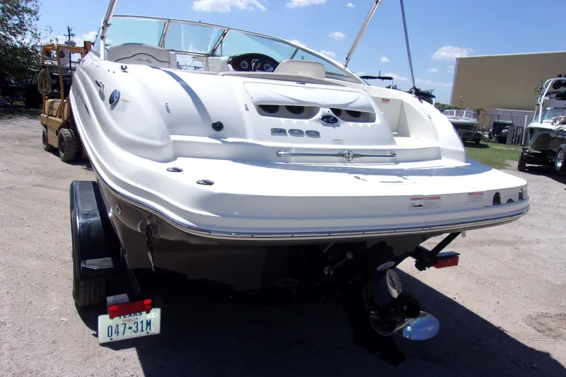 Slide: The Image of 2012 Sea Ray 200 Sundeck boat on trailer, rear view, sunny day. - 3