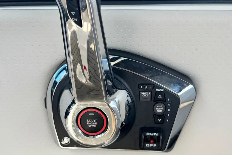 Slide: The Image of Control panel of 2025 Sea Ray SDX 250 Outboard boat with start engine button. - 12