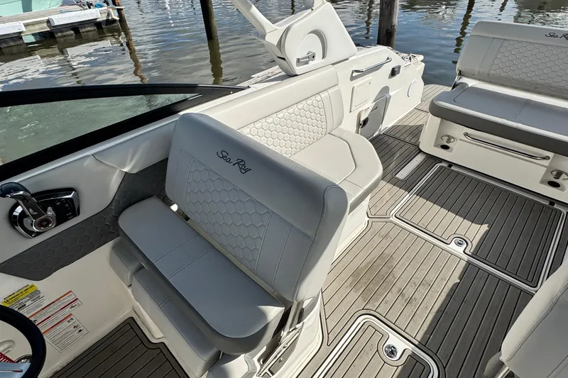 Slide: The Image of 2025 Sea Ray SDX 250 Outboard interior with luxurious seating and modern design. - 13