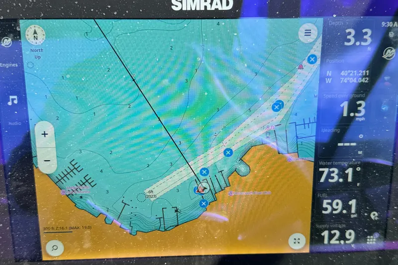 Slide: The Image of Simrad marine navigation display on 2025 Sea Ray SDX 250 Outboard, showing depth and position data. - 16