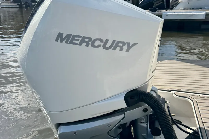 Slide: The Image of 2025 Sea Ray SDX 250 Outboard with Mercury engine at dockside. - 5