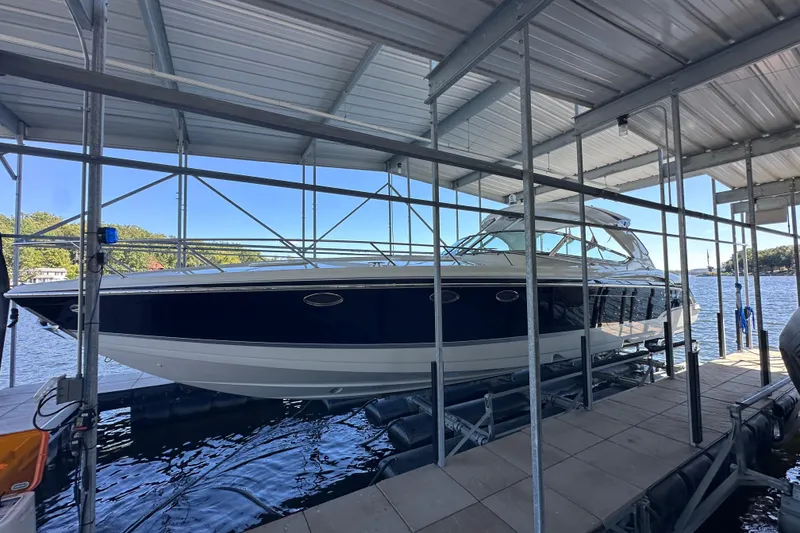 The Image of 2007 Formula 400 Super Sport boat docked in a marina with scenic background. - 0