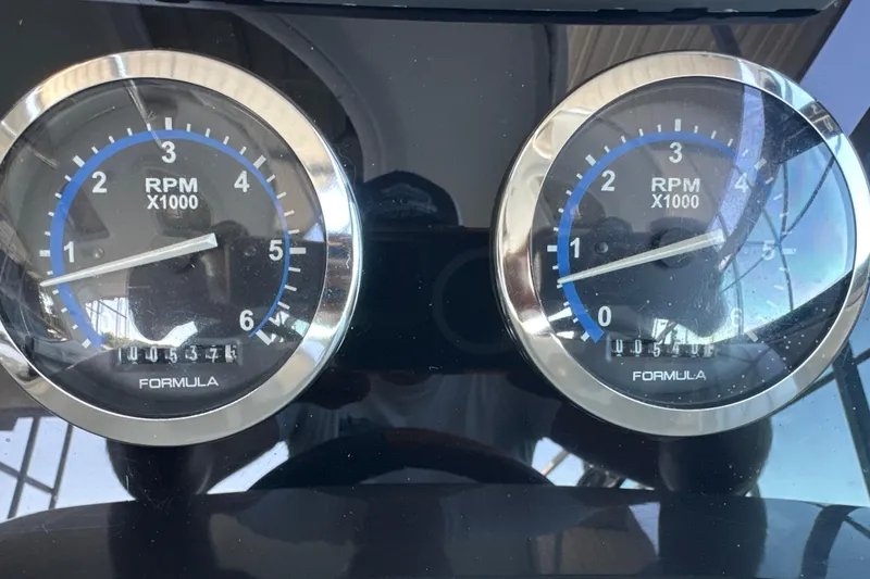 Slide: The Image of 2007 Formula 400 Super Sport boat docked under a covered marina. - 12