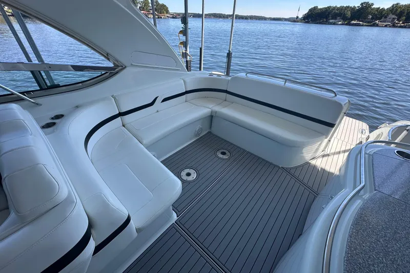 Slide: The Image of Interior of 2007 Formula 400 Super Sport boat with sleek dashboard and white seating. - 29