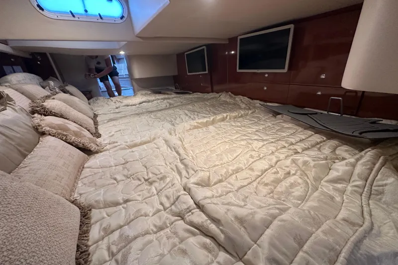 Slide: The Image of 2007 Formula 400 Super Sport boat interior with white seating and lake view. - 37