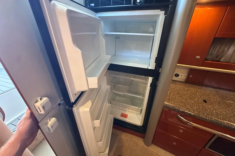 Slide: The Image of 2007 Formula 400 Super Sport yacht docked, top view with water and pier. - 42