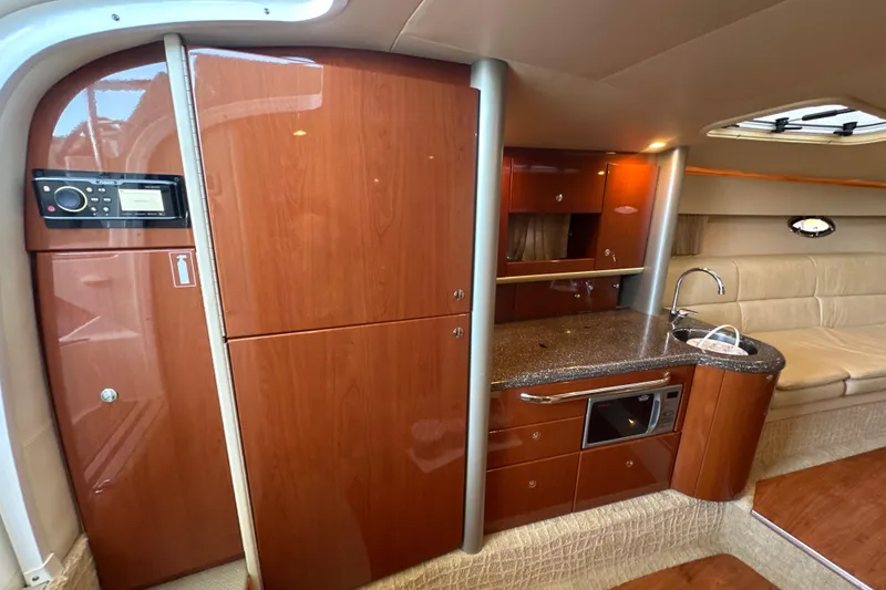 Slide: The Image of 2007 Formula 400 Super Sport boat interior with white seating and water view. - 43