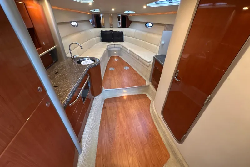 Slide: The Image of Luxurious cabin interior of a 2007 Formula 400 Super Sport yacht with plush bedding. - 45