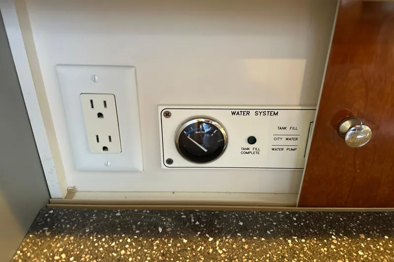 Slide: The Image of Open refrigerator inside a 2007 Formula 400 Super Sport boat kitchen. - 50