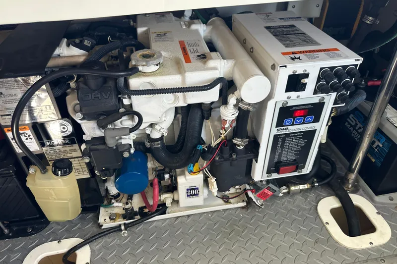 Slide: The Image of Engine compartment of a 2007 Formula 400 Super Sport boat, featuring Kohler generator. - 64