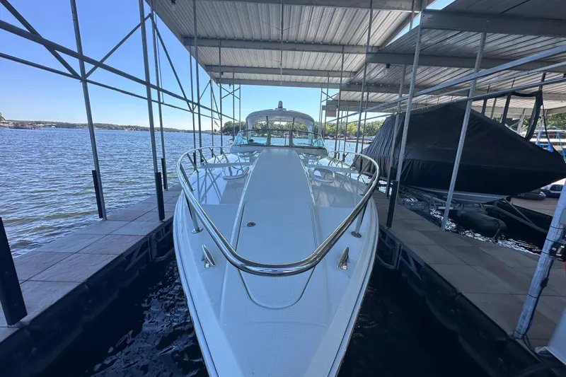 Slide: The Image of 2007 Formula 400 Super Sport boat docked under a covered marina. - 9