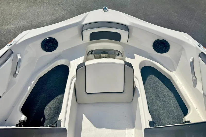 Slide: The Image of 2022 Yamaha Boats SX195 interior with seating and speakers, showcasing modern design. - 13