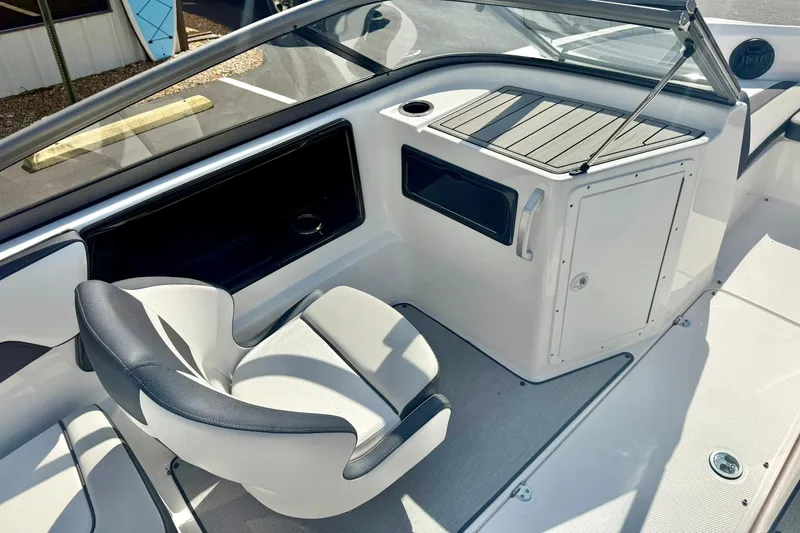 Slide: The Image of 2022 Yamaha Boats SX195 interior with seating and storage compartment. - 24