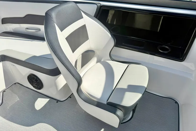 Slide: The Image of 2022 Yamaha Boats SX195 interior with sleek, modern seating and speaker detail. - 25