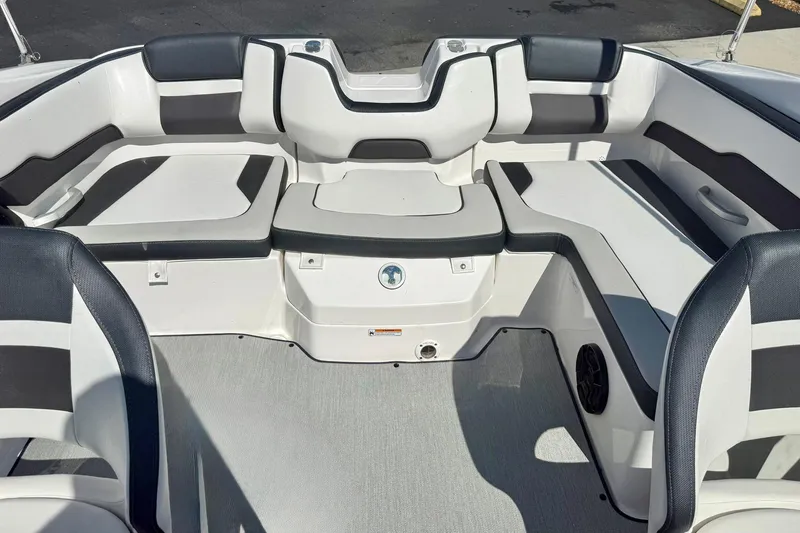 Slide: The Image of 2022 Yamaha Boats SX195 interior seating with black and white upholstery. - 30
