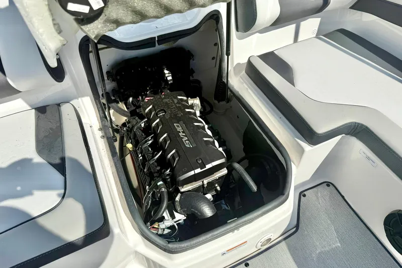 Slide: The Image of 2022 Yamaha Boats SX195 engine compartment, showcasing powerful engine and sleek interior design. - 33
