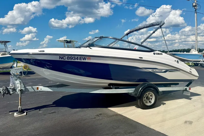 Slide: The Image of 2022 Yamaha Boats SX195 on trailer under blue sky with clouds. - 6