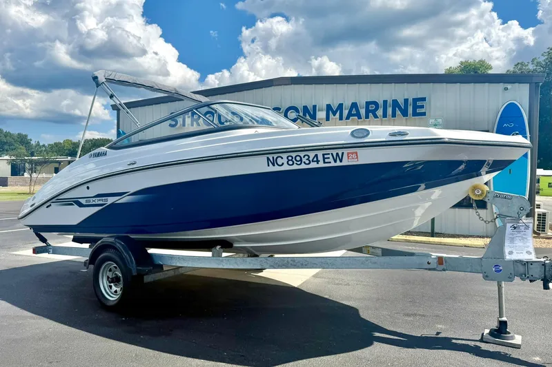 Slide: The Image of 2022 Yamaha Boats SX195 on trailer, parked outside Stroud & Son Marine. - 7