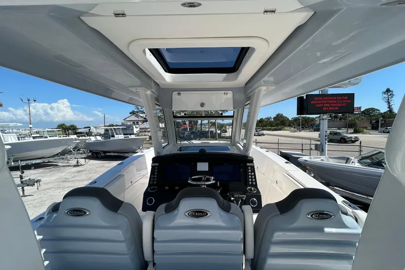 Slide: The Image of 2026 Robalo R360 Center Console boat interior with modern dashboard and seating. - 16