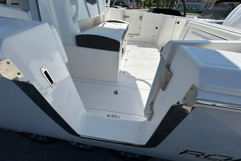 Slide: The Image of 2026 Robalo R360 Center Console boat interior with sleek white seating and modern design. - 4