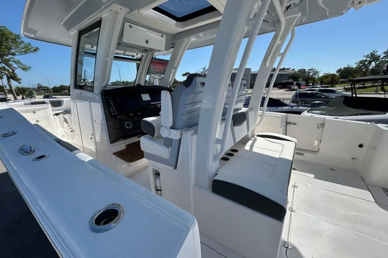 Slide: The Image of 2026 Robalo R360 Center Console boat interior with helm and seating area. - 5