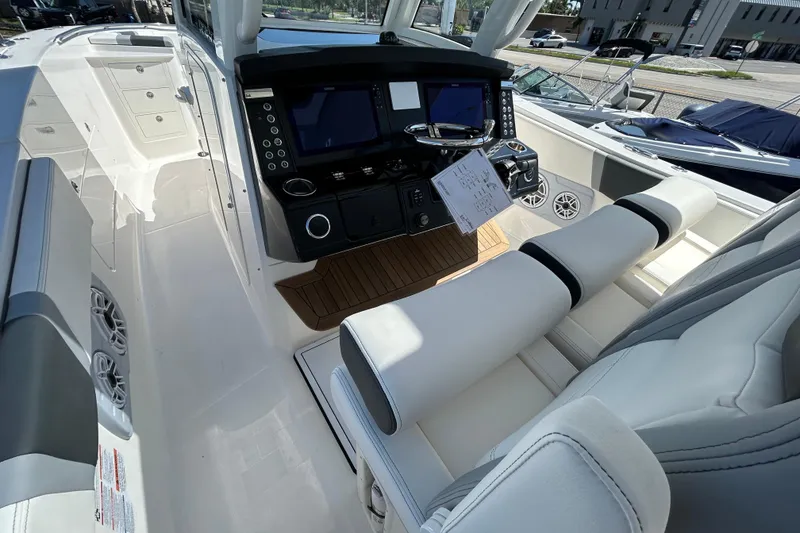 Slide: The Image of 2026 Robalo R360 Center Console boat interior with modern dashboard and seating. - 8