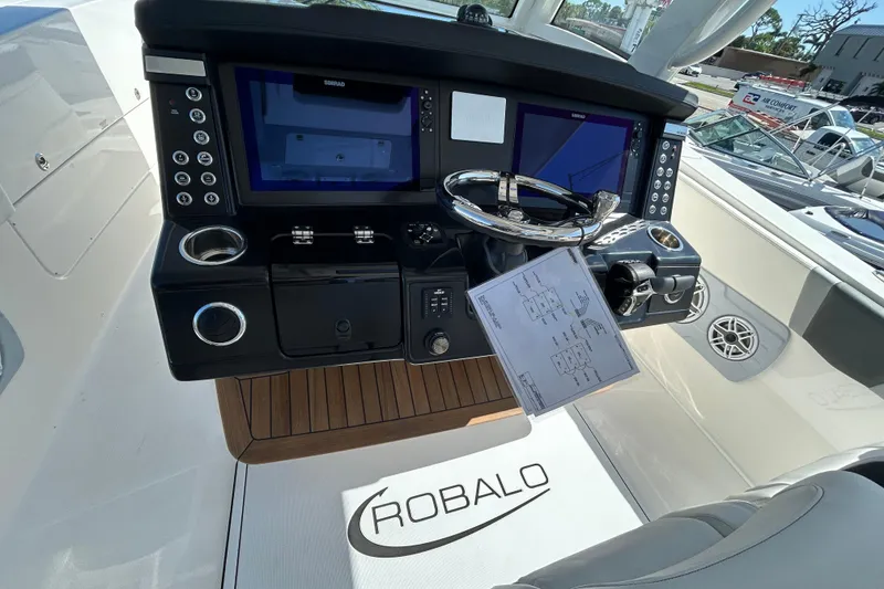 Slide: The Image of 2026 Robalo R360 Center Console helm with advanced navigation displays and controls. - 9