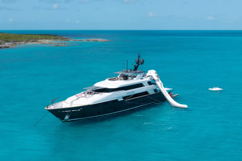 Slide: The Image of Luxurious 2000 Trinity Yachts Trinity 160 anchored in clear turquoise waters. - 0
