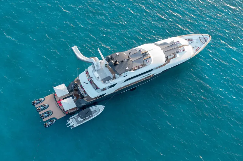 Slide: The Image of Aerial view of 2000 Trinity Yachts Trinity 160 luxury yacht on turquoise water. - 1