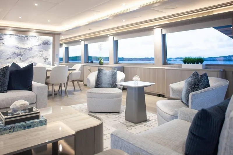 Slide: The Image of Luxurious interior of 2000 Trinity Yachts Trinity 160, featuring elegant seating and large windows. - 13